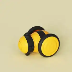 Robotic bee toy in yellow and black with wheels on a neutral backdrop.