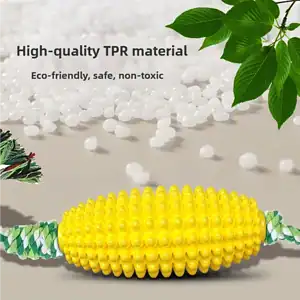 Yellow TPR dog toy with rope, eco-friendly and non-toxic, amid green leaves and white pellets. "High-quality TPR material.