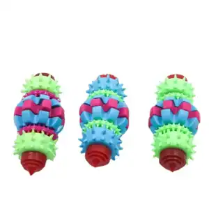 Three spiked dog chew toys with alternating rings in blue, green, pink, and red.