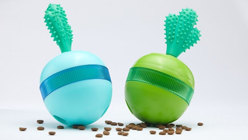 2 cactus shape food dispensers, one green, one blue