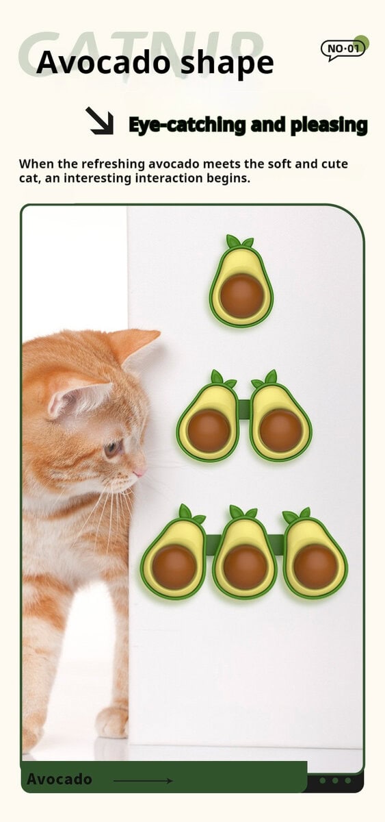 A ginger cat looks at four avocado-shaped catnip wall toys with green edges and brown centers on a vertical surface.