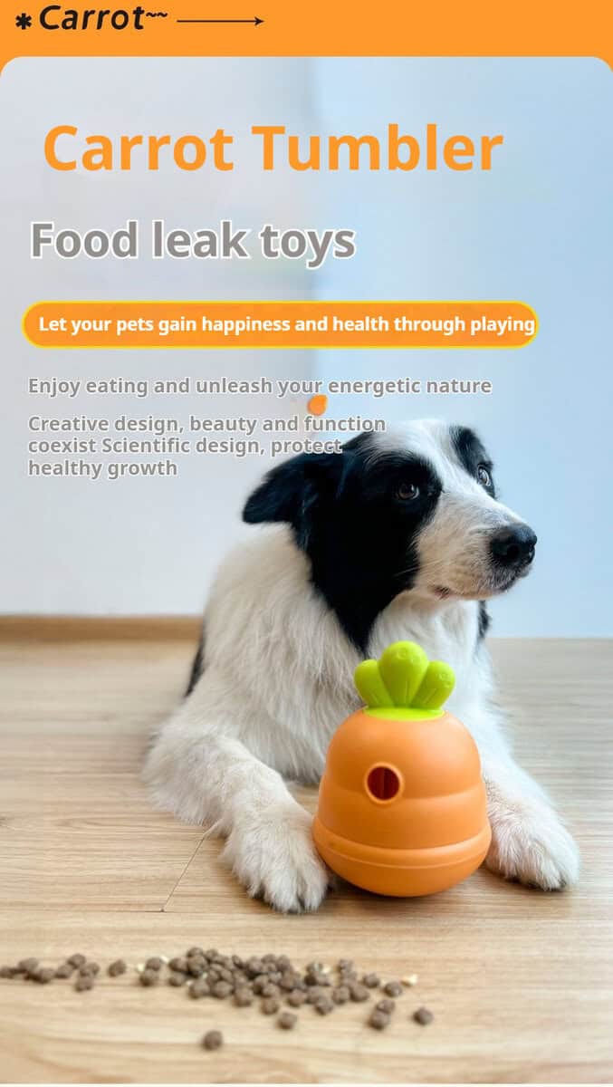 Black and white dog sits with a carrot treat toy, surrounded by scattered kibble on the floor.
