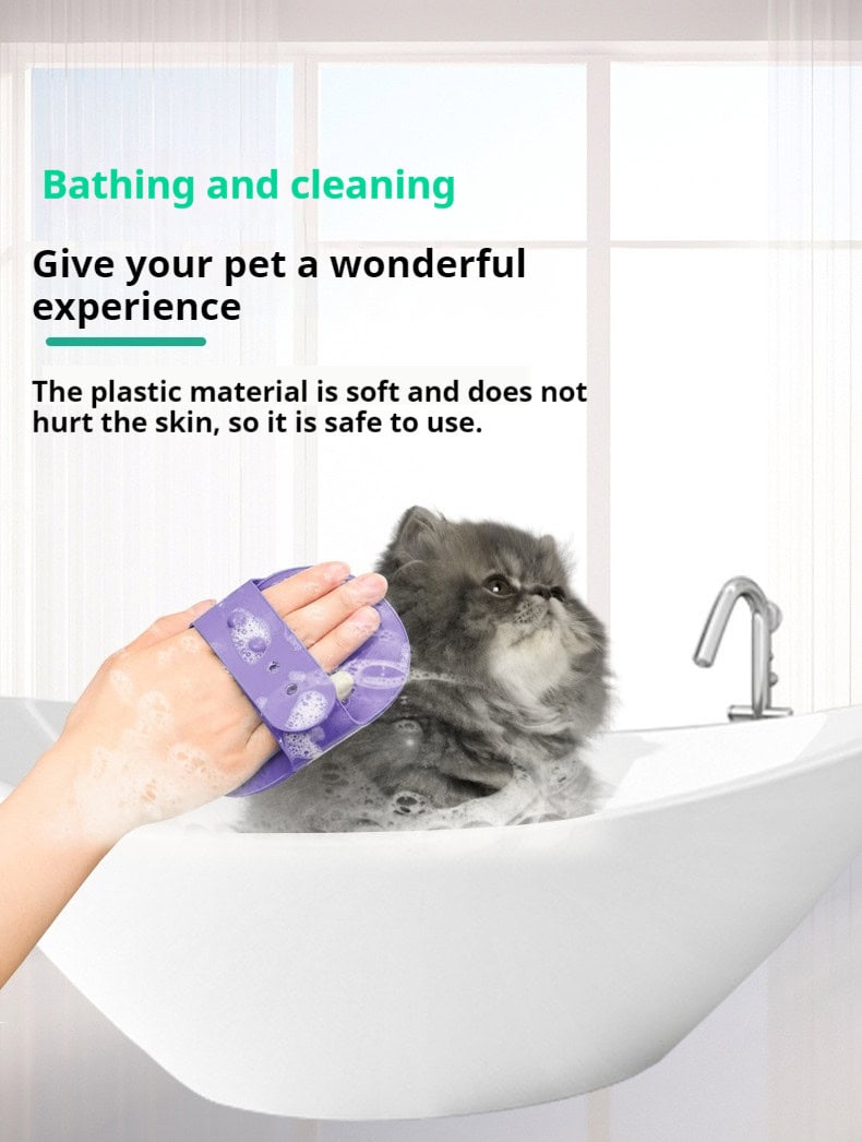 A person uses a grooming brush to wash a fluffy grey cat in a white tub, showing the tool’s effectiveness.