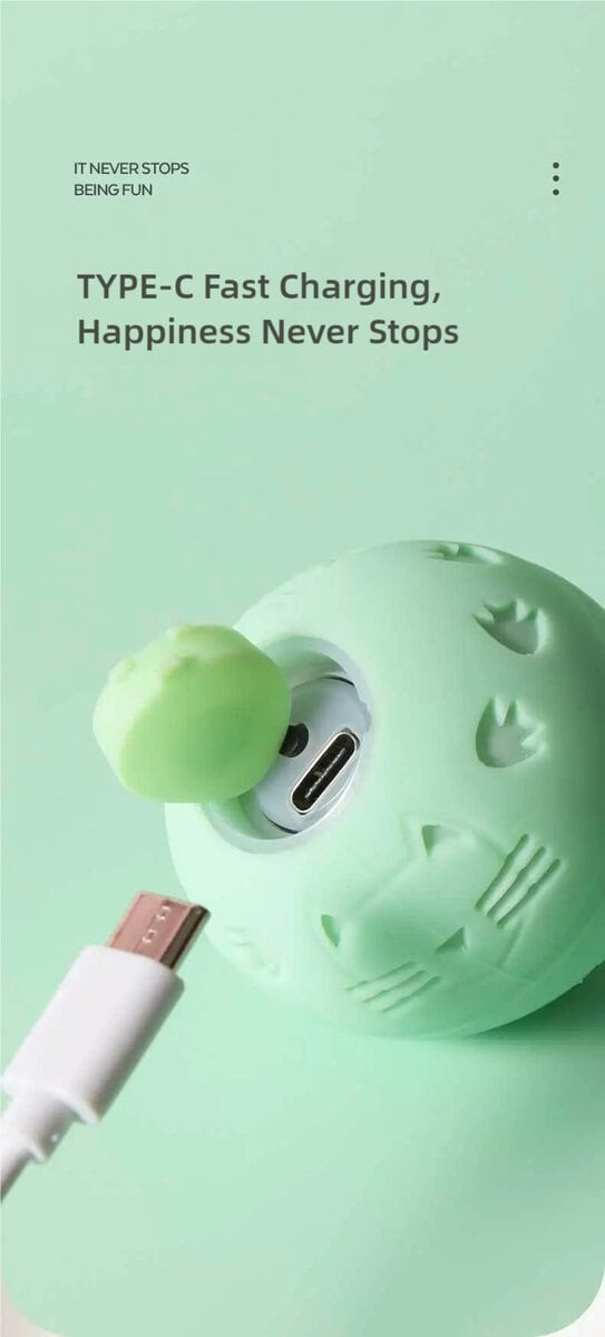 Mint green round cat toy with jack-o'-lantern face, Type-C port, and fast-charging cable for nonstop fun.