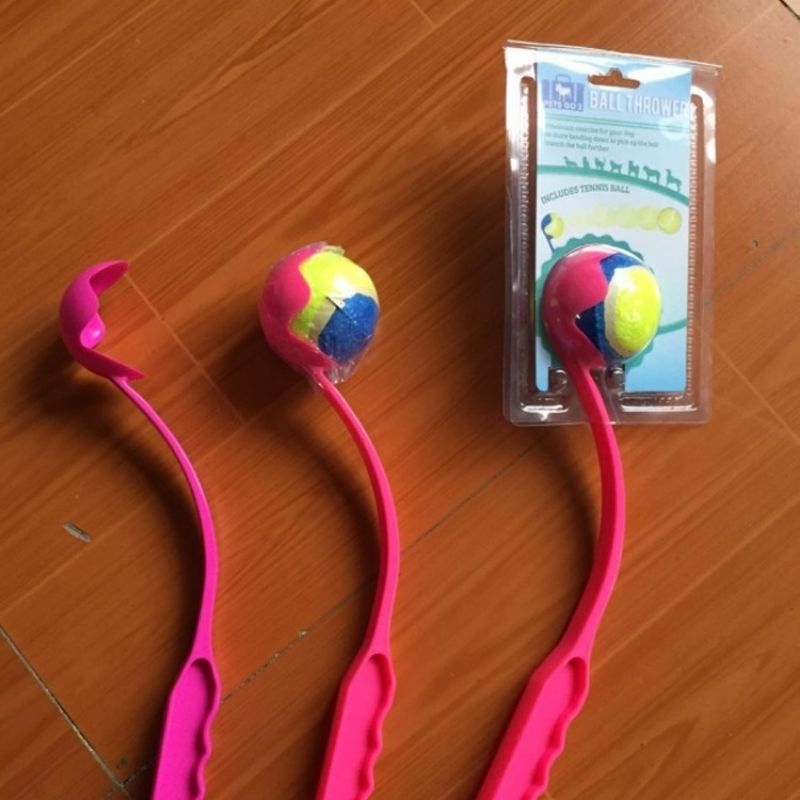 Colorful tennis ball launcher for pets, includes tennis ball, perfect for dogs, interactive play, outdoor fun, durable plastic design, portable pet toy, high-quality pet accessories, deep blue home.