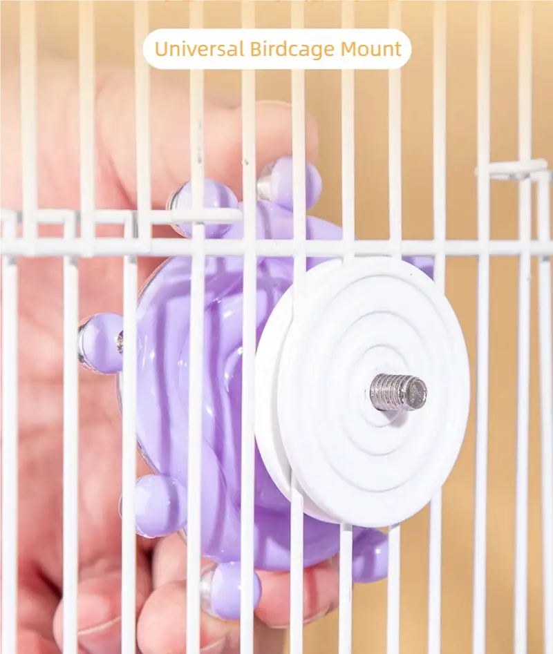 Close-up of a purple and white universal birdcage mount attached to a birdcage, designed for easy installation and secure hold for bird toys or accessories.