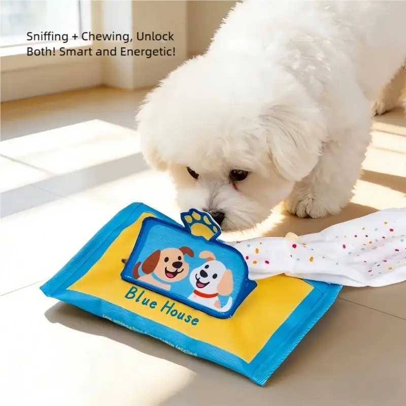 Cute white puppy chewing on a colorful puzzle toy with the words 'Blue House' and cartoon dog illustrations, promoting mental stimulation and fun.