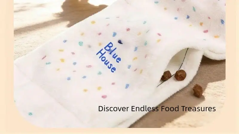White pet food towel with multicolored dots and blue text reading 'Blue House' for pet feeding and cleaning.