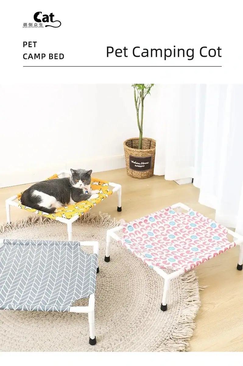 Pet camping cot with a gray and white geometric pattern, suitable for cats and small pets, placed indoors with a cat resting on it.
