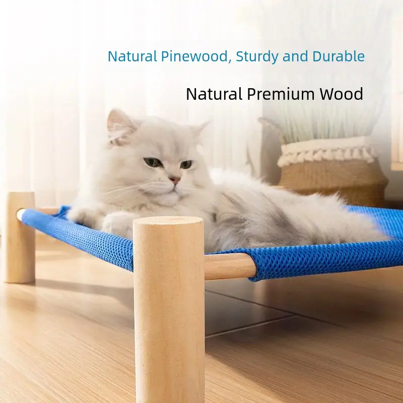 White fluffy cat relaxing on a natural pinewood pet bed with blue fabric surface, showcasing durable and sturdy design for pet comfort.