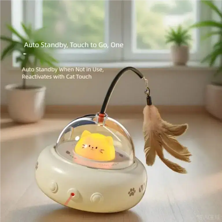 HEOU automatic cat toy with touch activation, featuring a cute yellow cat design inside a transparent dome, on a home windowsill with potted plants.