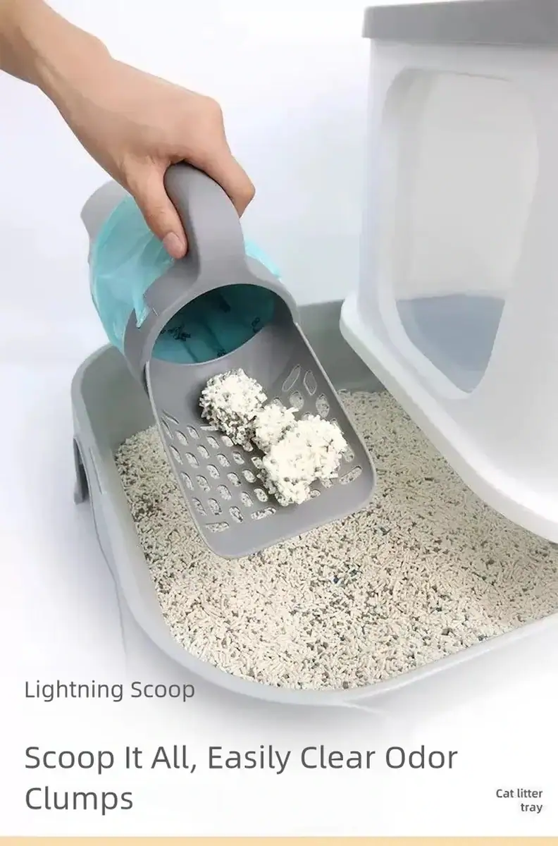 Hand using Lightning Scoop to remove clumped cat litter from a litter box for easy cleaning and odor control.