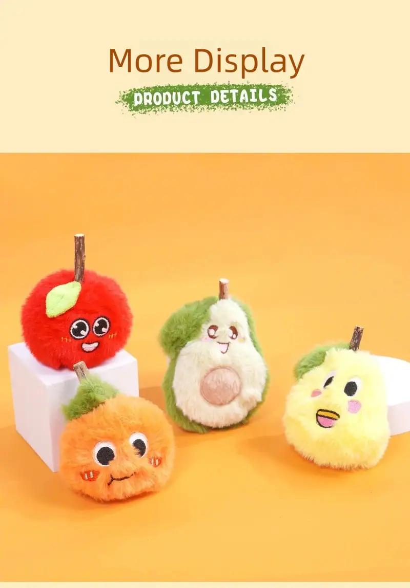 Colorful plush fruit toys with adorable faces, including an apple, pear, orange, and lemon, displayed on white blocks against a warm orange background.