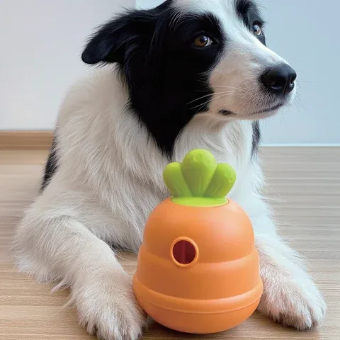 Carrot-shaped treat dispenser dog toy